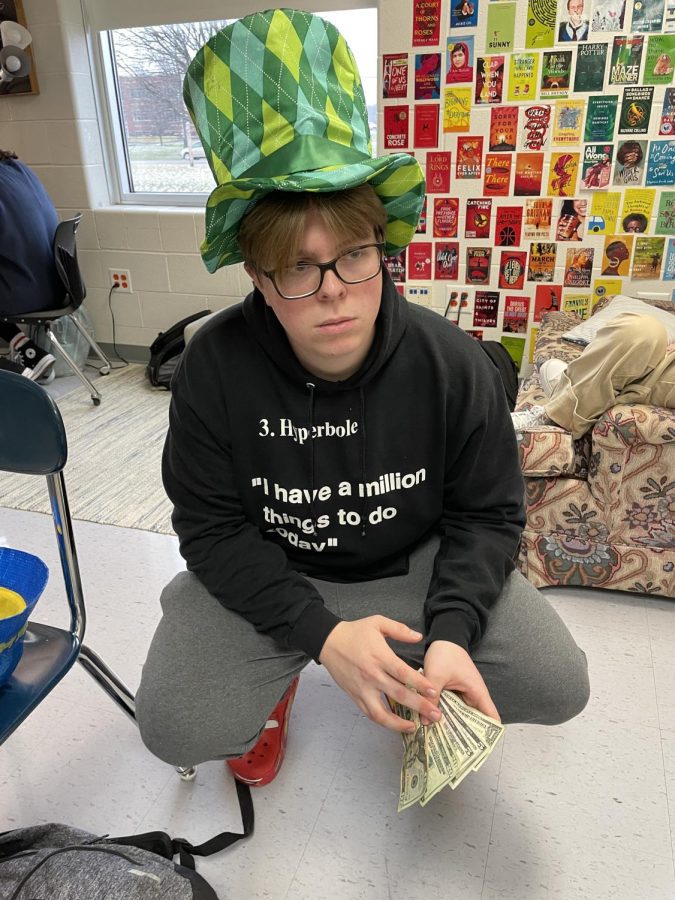 Ryan Mueller sports a top hat while posing for a photo.