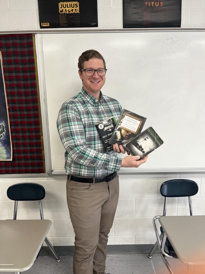 Mr. Potter poses with his personal favorite true crime novels.