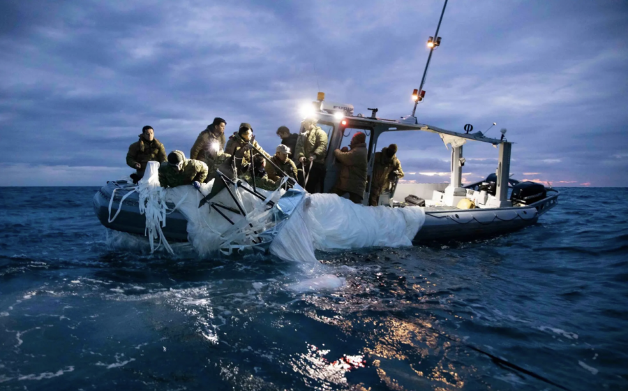 This picture provided by the U.S. Navy shows sailors recovering a Chinese high-altitude surveillance balloon off the coast of South Carolina.