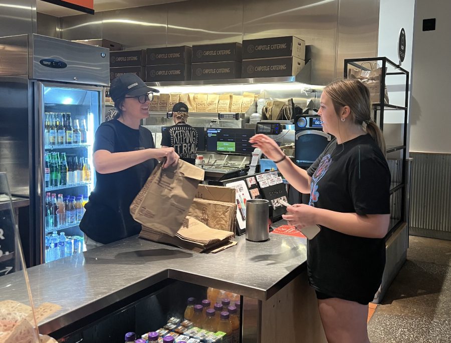 Alaina serves a customer at Chipotle Mexican Grille on Arlington Road.