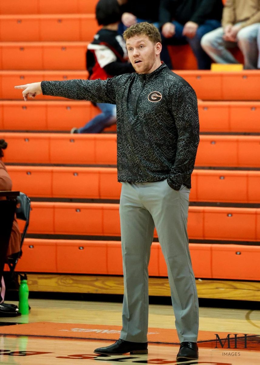 Green's Boys Junior Varsity head coach Michael Moran instructing his players against Lake.